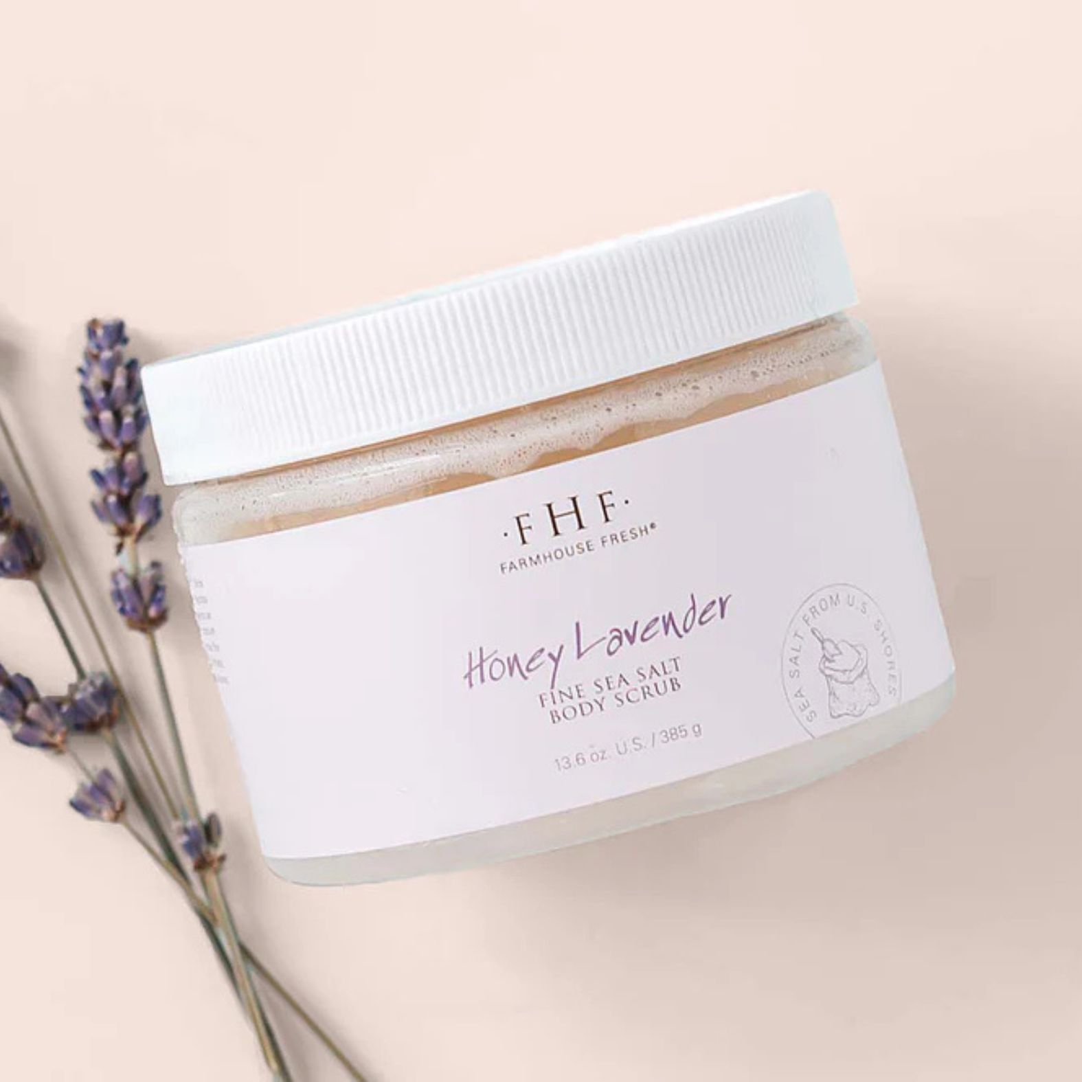 Farmhouse Fresh Honey Lavender Fine Sea Salt Body Polish with lavender flowers on a beige background | Build A Luxury Custom Gift Box for Women with Luxe & Bloom