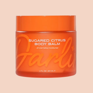 Darlin' Skincare Sugared Citrus Tallow Body Balm in an orange jar on a beige background | Build A Luxury Custom Gift Box for Women with Luxe & Bloom