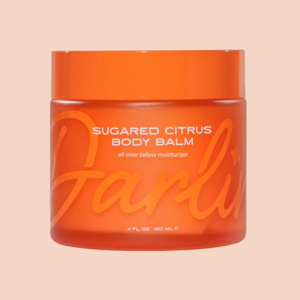 Darlin' Skincare Sugared Citrus Tallow Body Balm in an orange jar on a beige background | Build A Luxury Custom Gift Box for Women with Luxe & Bloom