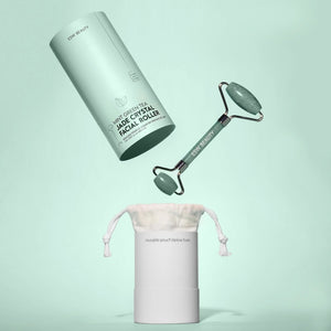 ESW Beauty Jade crystal facial roller with carrying pouch on a light green background | Build A Luxury Custom Gift Box with Luxe & Bloom