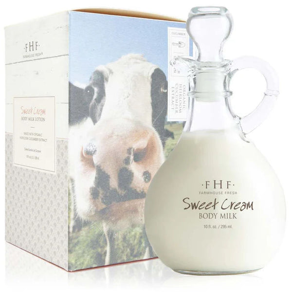 Glass bottle of Sweet Cream Body Milk with packaging featuring a cow in the background