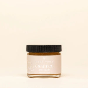 Jar of Hon's Honey creamed raw honey on a beige background | Build A Luxury Custom Gift Box for Women with Luxe & Bloom