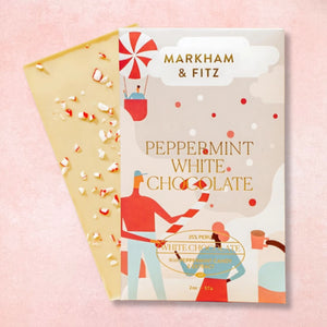 Markham & Fitz peppermint white chocolate packaging on a pink background
