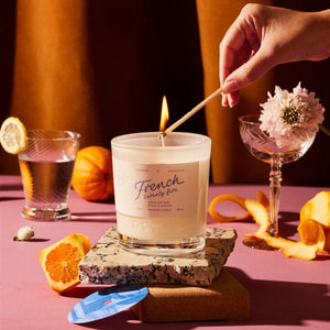 Rewined French 75 Candle Being Lit With A Match | Build A Luxury Custom Gift Box for Women