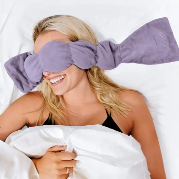 Woman Wearing The Nodpod Wisteria Weighted Eye Mask | Build A Luxury Custom Gift Box for Women