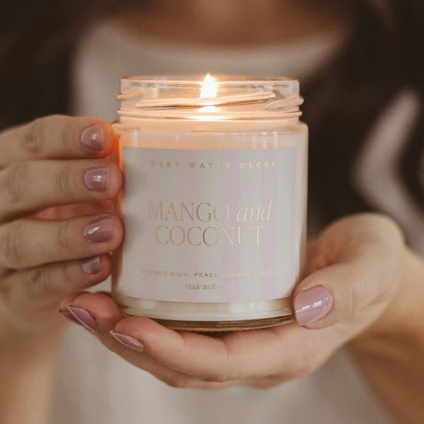 Woman Holding Sweet Water Decor Mango & Coconut Candle | Build A Luxury Custom Gift Box for Women with Luxe & Bloom