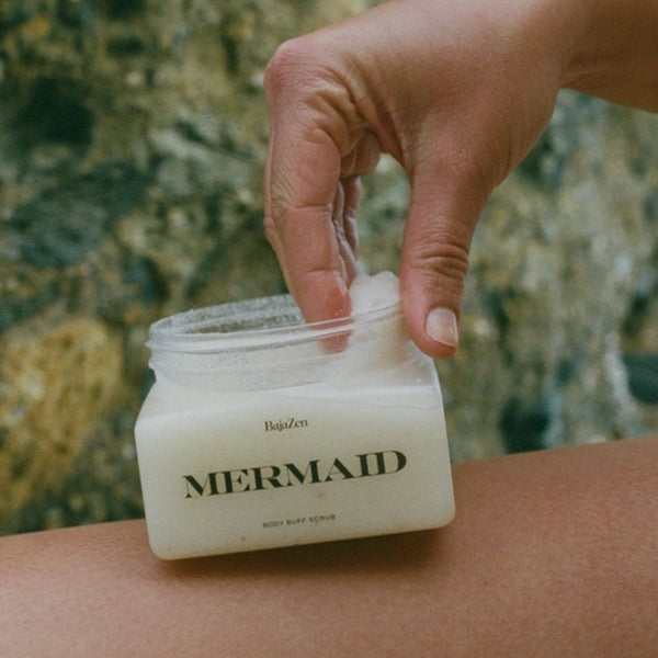 Person applying BajaZen Mermaid Body Buff Scrub with a beach in the background | Build A Luxury Custom Gift Box for Women with Luxe & Bloom