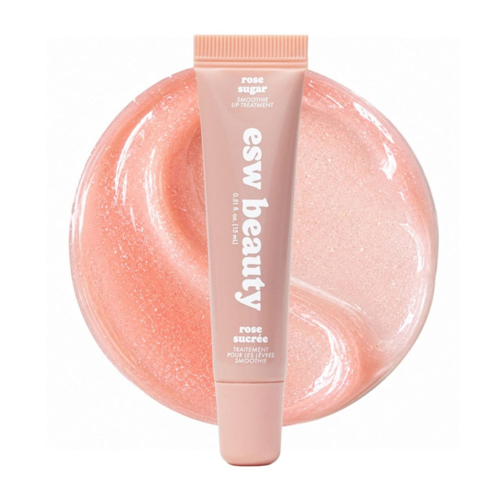 A squeeze tube of esw beauty Rose Sugar Smoothie Lip Treatment, in a pale peach-pink shade, positioned in front of a circular texture swatch of the same shimmering peach-pink cream on a white background.