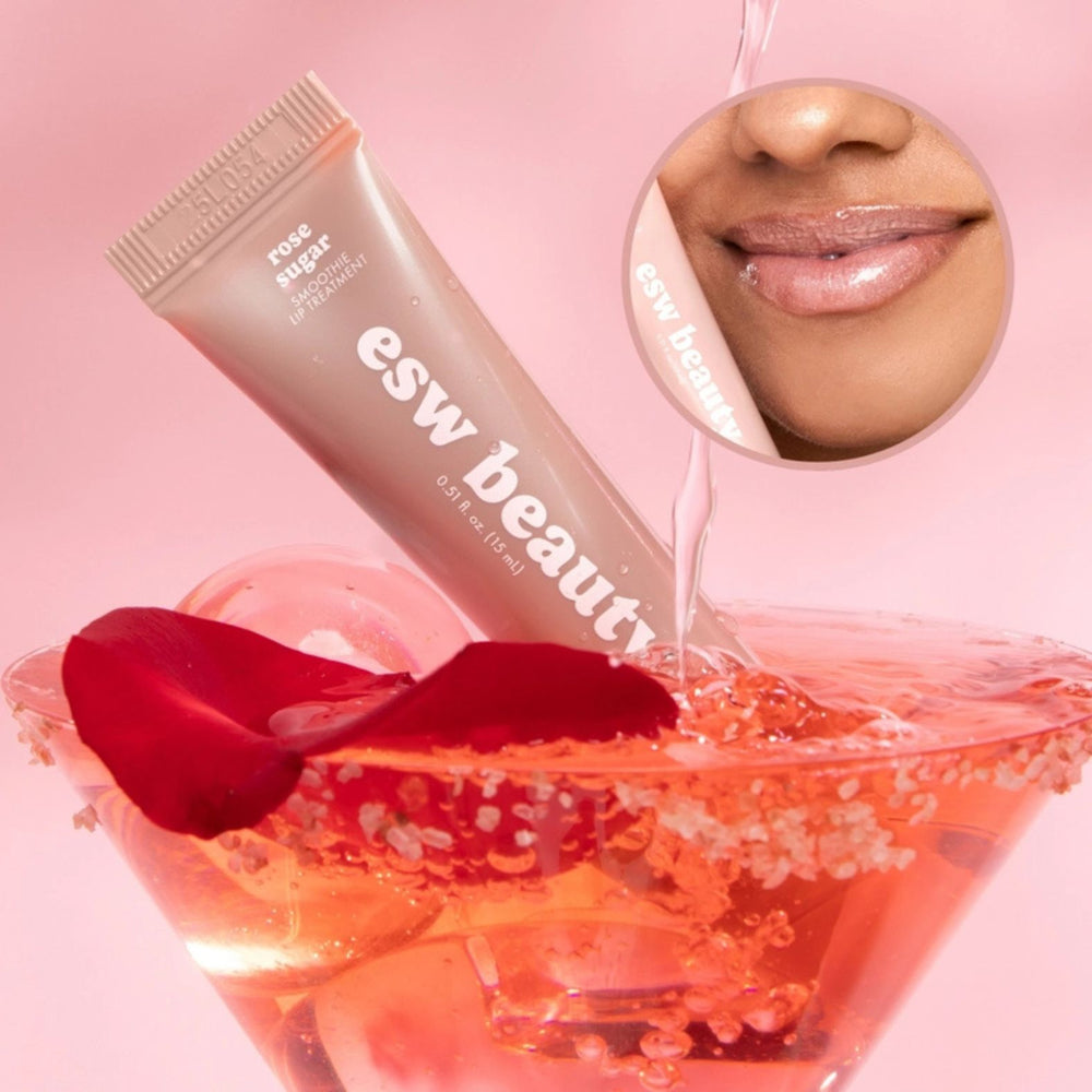 A squeeze tube of esw beauty Rose Sugar Smoothie Lip Treatment, in a pale peach-pink shade, positioned in front of a circular texture swatch of the same shimmering peach-pink cream on a white background.