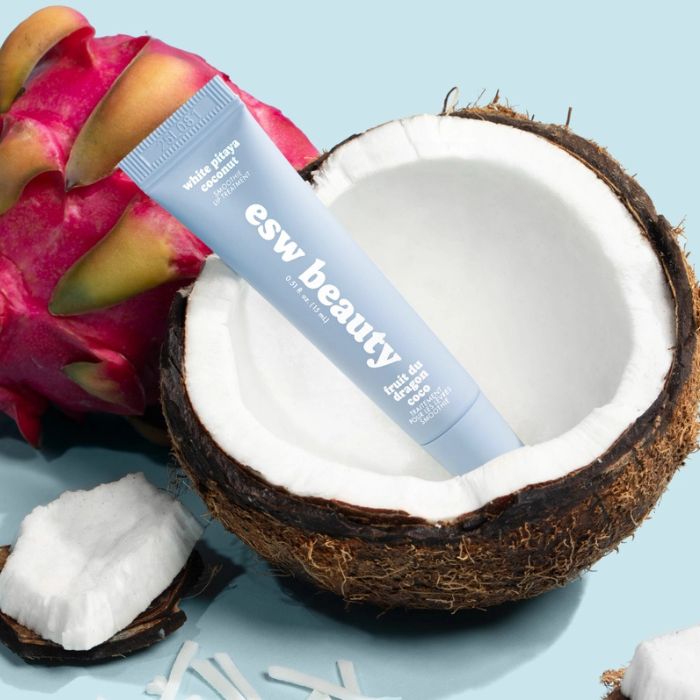 Blue tube of ESW Beauty White Pitaya Coconut Smoothie Lip Treatment on a light blue background | Build A Luxury Custom Gift Box for Women with Luxe & Bloom