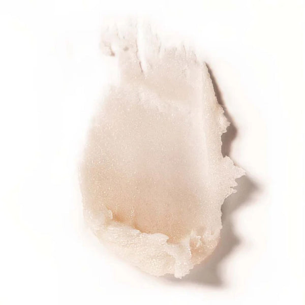 Close-up of Farmhouse Fresh One Fine Day® Flawless Face Polish product smear on a white background 