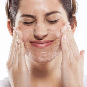 Woman applying Farmhouse Fresh One Fine Day® Flawless Face Polish | Build A Luxury Custom Gift Box for Women with Luxe & Bloom