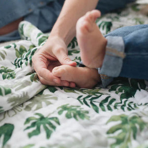 Little Unicorn Tropical Leaf Cotton Muslin Swaddle Blanket | Build A Luxury Custom Baby Gift Box with Luxe & Bloom