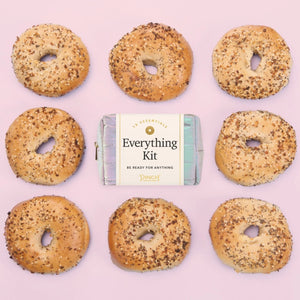 Bagels with everything seasoning and a Pinch Provisions 'Everything Kit' packaging on a pink background | Build A Luxury Custom Gift Box for Women from Luxe & Bloom