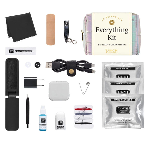 Pinch Provisions Puffer Everything Kit contents including a bandage, nail clipper, USB cable, and various personal care products on a white background.