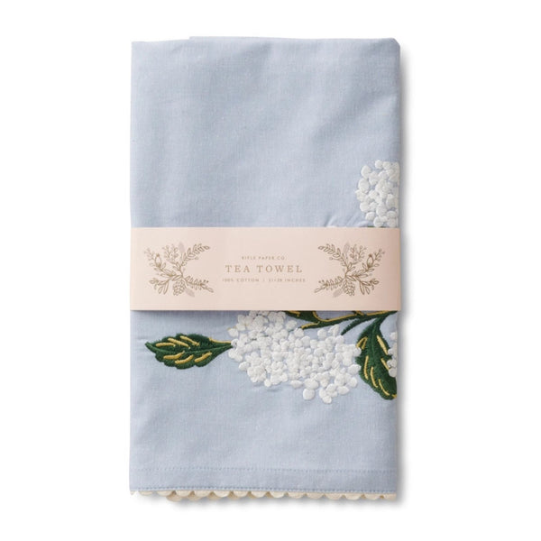 Folded Rifle Paper Co. Light Blue Hydrangea Embroidered Tea Towel on a white background | Build A Luxury Custom Gift Box for Women with Luxe & Bloom
