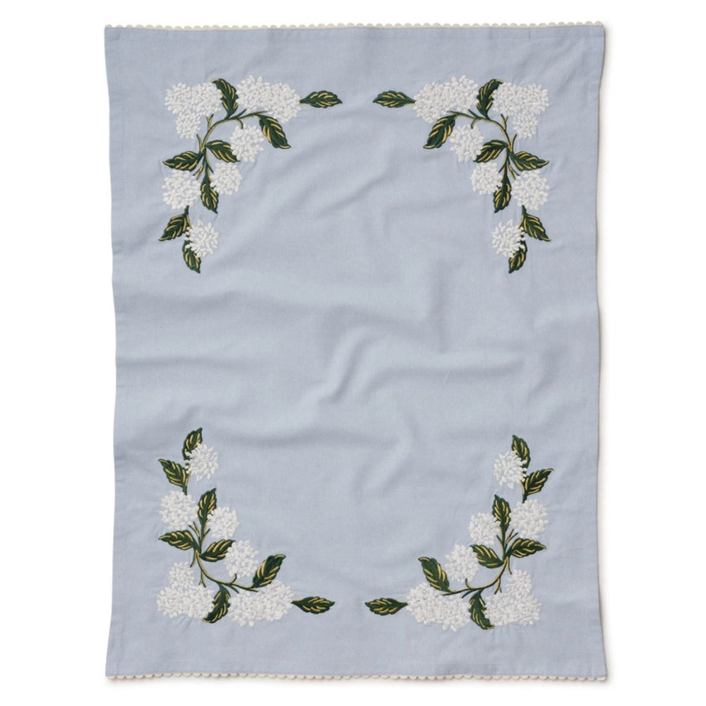 Folded Rifle Paper Co. Light Blue Hydrangea Embroidered Tea Towel on a white background | Build A Luxury Custom Gift Box for Women with Luxe & Bloom