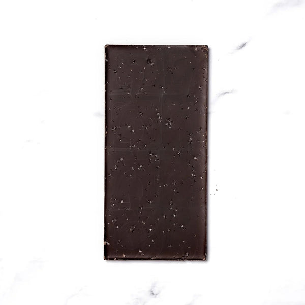 Ritual Chocolate Fleur De Sel Chocolate Bar close-up with sea salt one chocolate on a white background | Build A Luxury Custom Gift Box with Luxe & Bloom