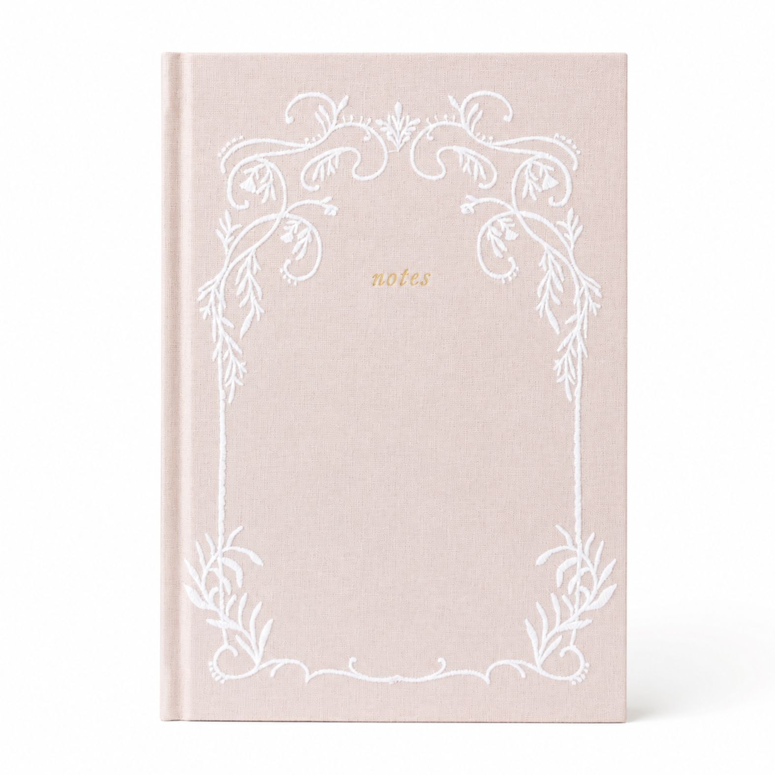 Selah Publications The Lainey Notebook: A linen colored hardcover notebook with a white ornate stitched floral border and the word 'notes' in small gold script near the upper center, shown on a clean white background.