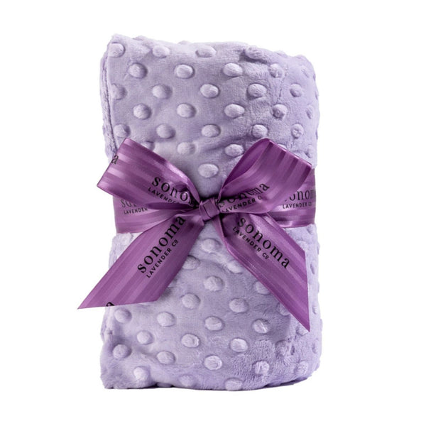 Sonoma Lavender Heated Spa Wrap in Lilac Dot fabric with a purple ribbon on a white background