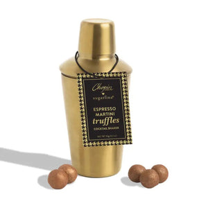 A gold cocktail shaker tin with a black and gold hanging label reading 'Chopin Sugarfina Espresso Martini Truffles Cocktail Shaker,' shown on a white background with several brown truffles placed in front.