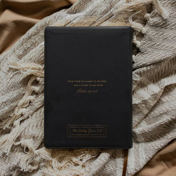 Back of The Daily Grace Co. Morning Glory ESV Wide Margin Reference Bible with the words " Your word is a lamp to my feet and a light to my path." Psalm 119:105" written in gold on the back cover 