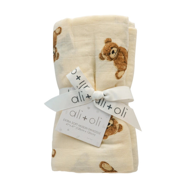 Ali + Oli folded muslin swaddle with teddy bear pattern on a white background | Build A Luxury Custom Baby Gift Box with Luxe & Bloom