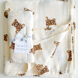 Ali + Oli Baby swaddle blanket with teddy bear pattern on a white background