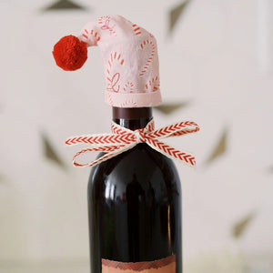 Doe A Deer Candy Cane Wine Topper shown on a bottle of wine | Build A Custom Christmas Gift Box with Luxe & Bloom