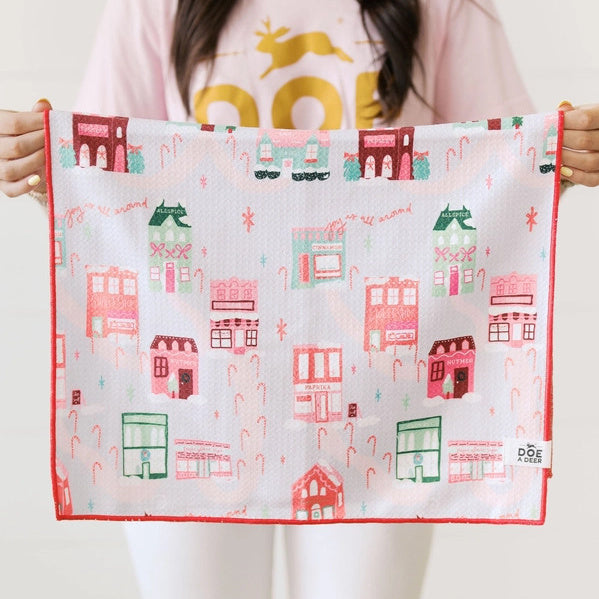 Woman holding Doe A Deer Christmas in the Village Waffle Kitchen Towel | Build A Luxury Custom Christmas Gift Box for Women with Luxe & Bloom