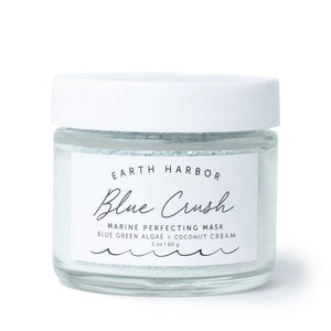 Glass jar of Earth Harbor Blue Crush Marine Perfecting Mask on a white background
