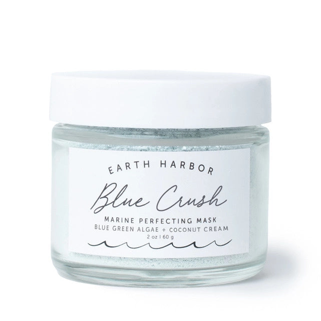 Glass jar of Earth Harbor Blue Crush Marine Perfecting Mask on a white background