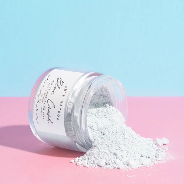 Glass jar of Earth Harbor Blue Crush Marine Perfecting Mask on a white background
