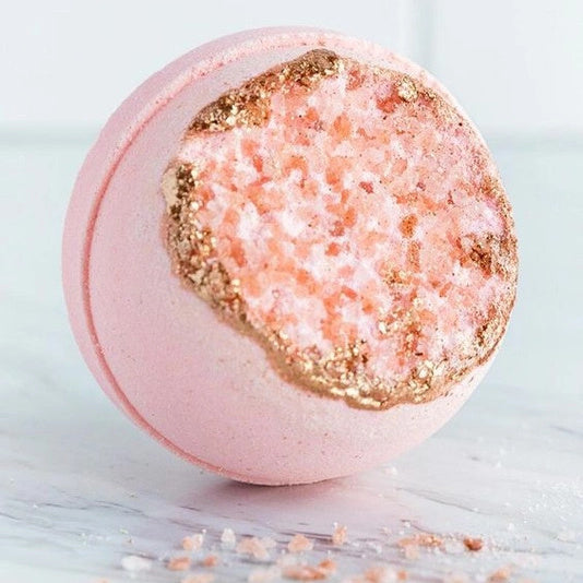 Latika Beauty Rose Quartz Geode bath bomb with packaging on a beige background | Build A Luxury Custom Gift Box for Women with Luxe & Bloom