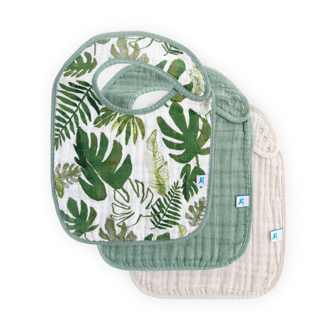 Little Unicorn Tropical Leaf Set of three bibs with tropical leaf pattern, plain green, and beige designs on a white background |  Precious Baby Boy Luxury Curated Gift Box