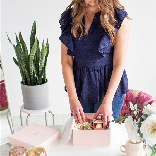 Luxury Curated Gift Boxes For Women | Luxe & Bloom Owner Putting Together A Pink Custom Gift Box