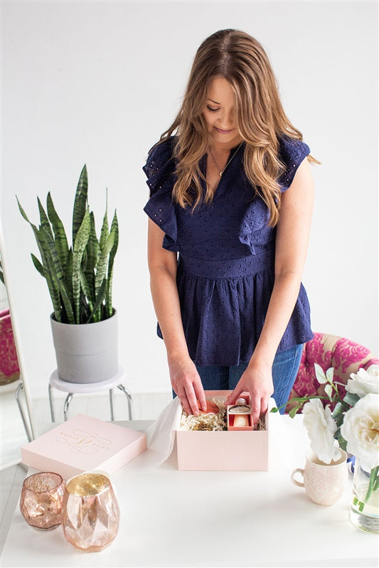 Luxury Curated Gift Boxes For Women | Luxe & Bloom Owner Putting Together A Pink Custom Gift Box