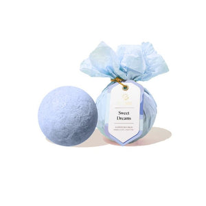 Musee light blue Sweet Dreams bath bomb with a label on a white background | Build A Luxury Custom Gift Box for Women with Luxe & Bloom