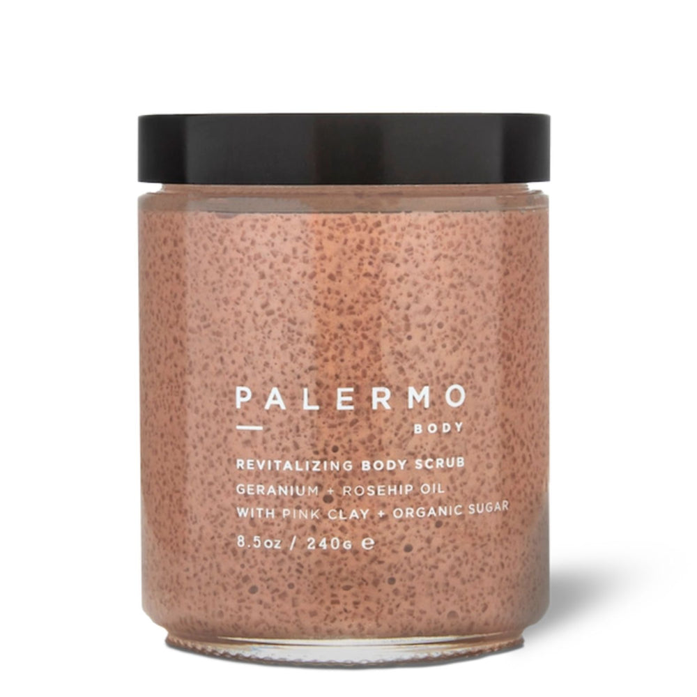 A jar of Palermo Body Revitalizing Body Scrub with pink clay and organic sugar, featuring a speckled pink scrub inside a clear glass jar with a black lid, on a white background | Build A Luxury Custom Gift Box for Women with Luxe & Bloom