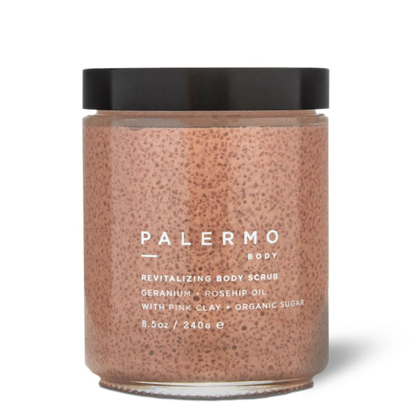 A jar of Palermo Body Revitalizing Body Scrub with pink clay and organic sugar, featuring a speckled pink scrub inside a clear glass jar with a black lid, on a white background | Build A Luxury Custom Gift Box for Women with Luxe & Bloom