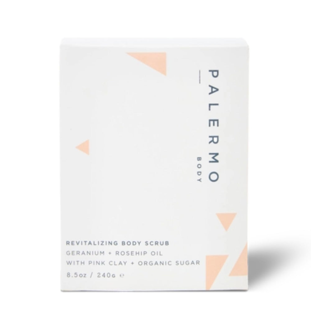 A jar of Palermo Body Revitalizing Body Scrub with pink clay and organic sugar, featuring a speckled pink scrub inside a clear glass jar with a black lid, on a white background | Build A Luxury Custom Gift Box for Women with Luxe & Bloom
