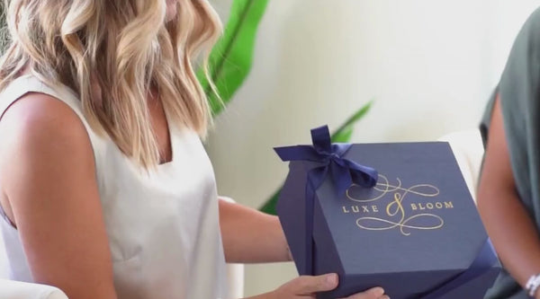 Video Of A Woman Giving Her Friend A Luxe & Bloom Gift Box and Then They Hug