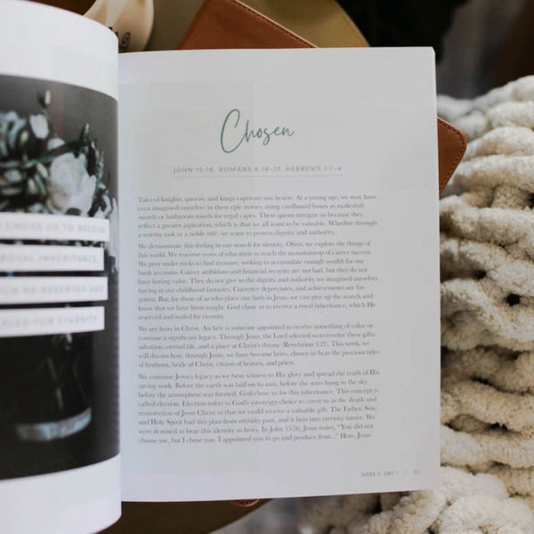 Open The Daily Grace Co. Devotional called 'Worthy: embracing your identity in Christ' with text and a photo, placed on a textured surface.