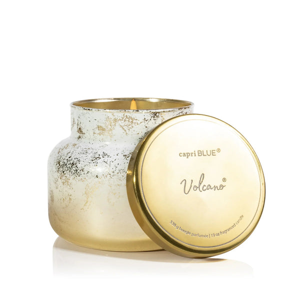 Capri Blue Volcano Glimmer 19 oz candle with gold lid on a white background